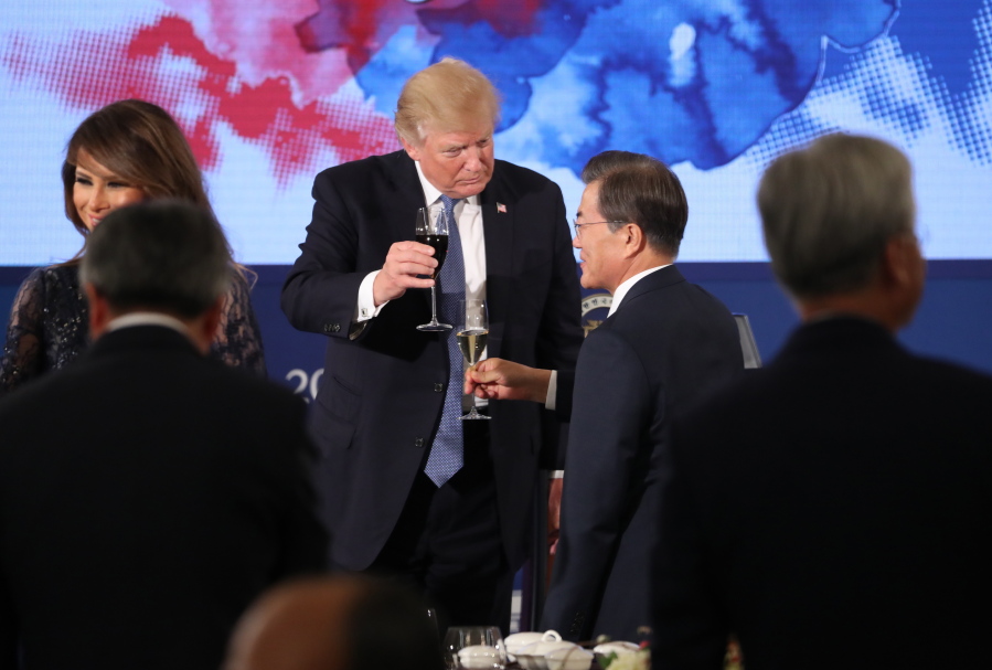U.S. President Donald Trump and South Korean President Moon Jae-in toast at the start of a dinner at the Blue House in Seoul, South Korea, on Tuesday. Trump is on a five country trip through Asia traveling to Japan, South Korea, China, Vietnam and the Philippines.