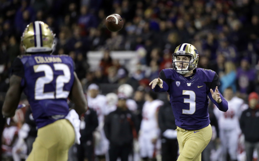 Washington quarterback Jake Browning (3) throws a pass to Lavon Coleman for a 6-yard touchdown against Utah during the first half of an NCAA college football game Saturday, Nov. 18, 2017, in Seattle.