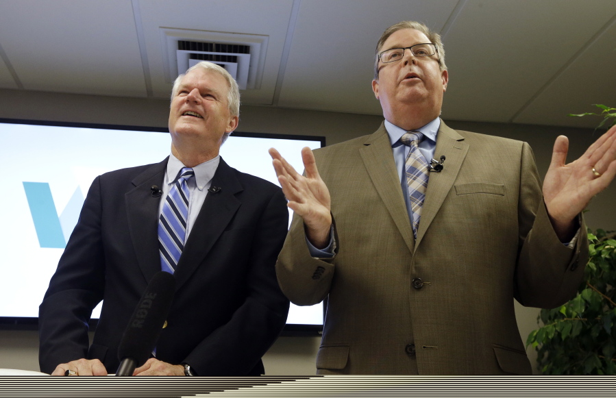 Former Democratic Congressman, Brian Baird, left, and former Republican State Representative Chris Vance, speak at a news conference Thursday, Nov. 16, 2017, in Seattle. They announced the launch of a new effort to promote independent, centrist-minded politicians in Washington state. The move is part of a national movement to curb partisanship.