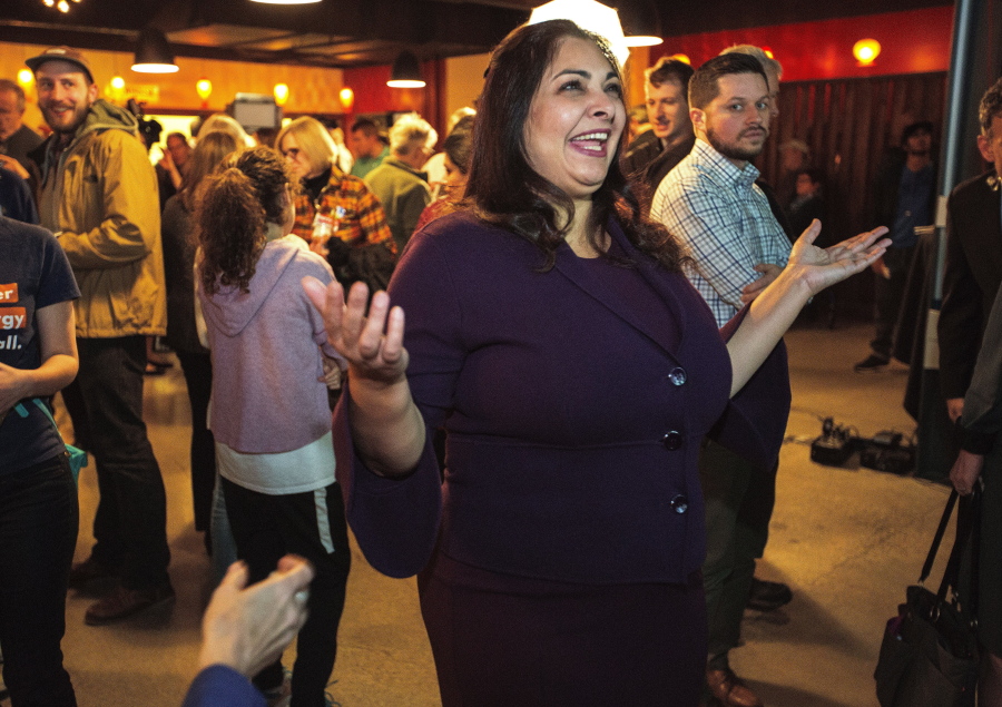 Democrat Manka Dhingra, running for state Senator for the 45th District, greets supporters in Woodinville on Tuesday.