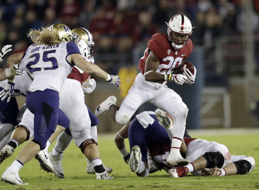 Stanford ‘s Bryce Love (20) runs against Washington during the first half of an NCAA college football game Friday, Nov. 10, 2017, in Stanford, Calif.