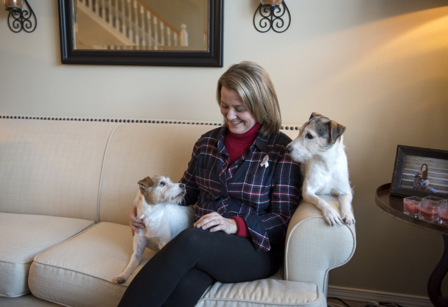 Dawn Horner sits for a portrait in November with her Jack Russell terriers, Mollie and Cooper, at her Vancouver home. Horner was diagnosed with Stage 4 lung cancer in 2014. She has never smoked — though most everyone assumes she must have — and she is now dedicated to educating people about lung cancer.
