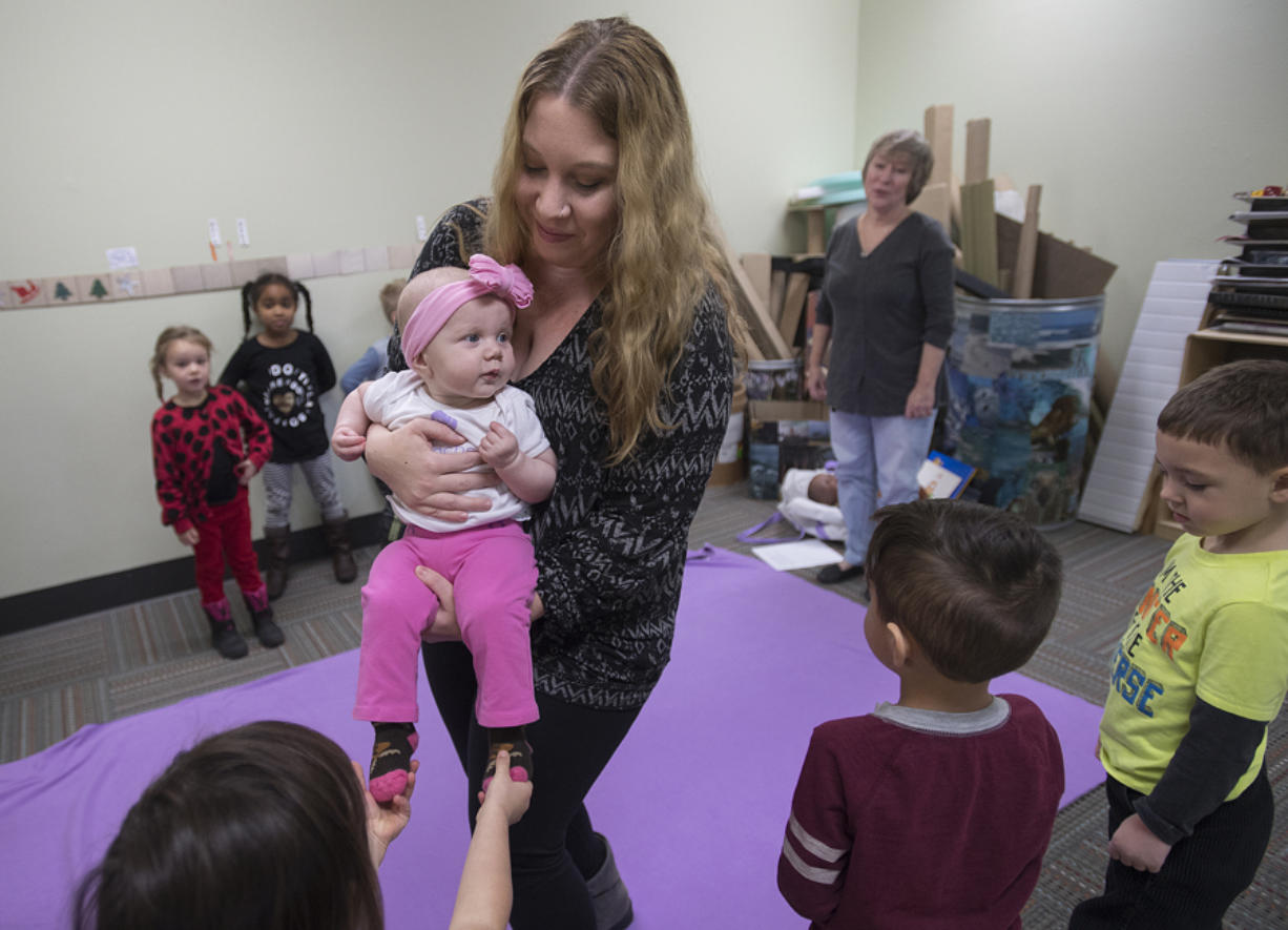 Vancouver resident Alyson Boyse and her daughter, 6-month-old Maya, say goodbye to YWCA Care Children’s Program students after a recent Seeds of Empathy class. The program provides an opportunity for moms with infants to bring their babies in and allow the children a chance to engage with and talk about the baby.