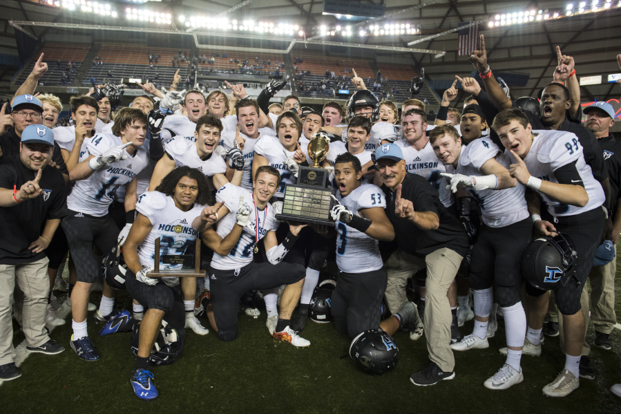 Hockinson celebrates its 35-22 win over Tumwater after the 2A state football championship game Saturday in Tacoma.