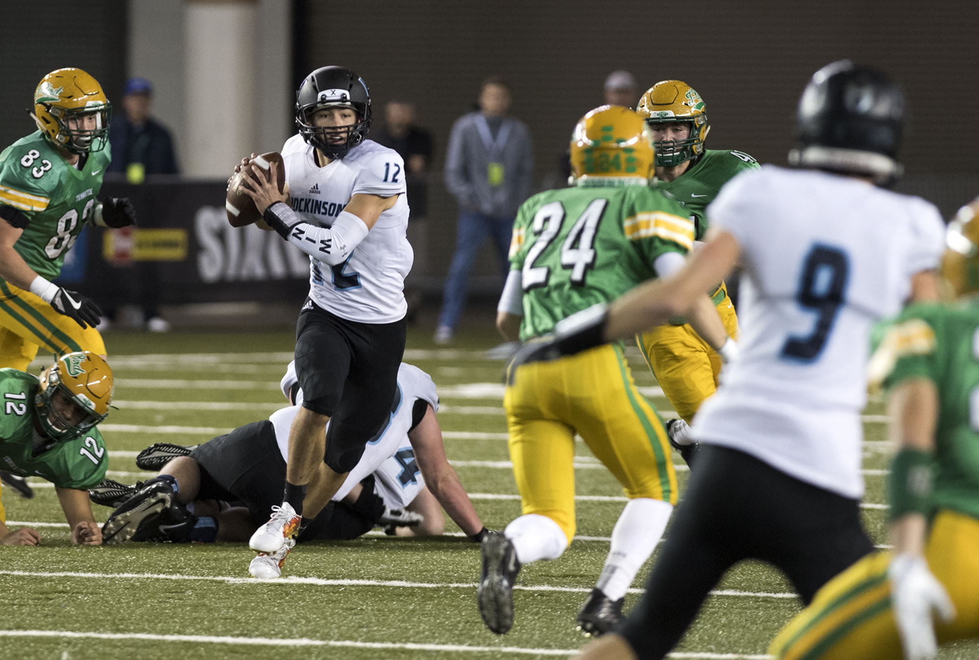 Hockinson's Canon Racanelli (12) looks for an open receiver during the 2A state football championship game against Tumwater on Saturday, Dec. 2, 2017, in Tacoma, Wash.