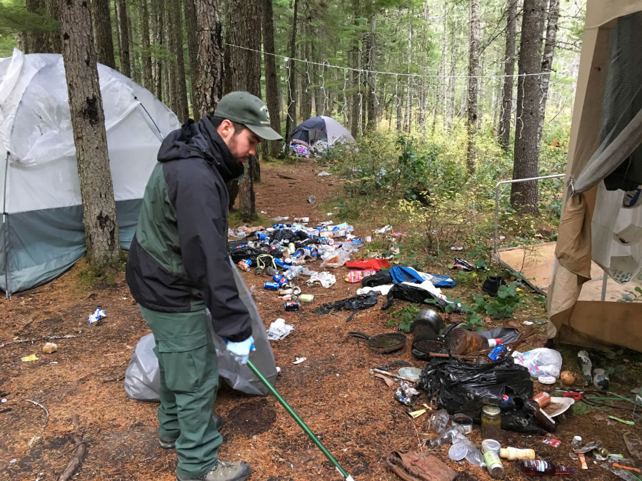 U.S. Forest Service workers clean up a trashed campsite on Mount St. Helens National Volcanic Monument late this summer. Forest Service officials say they saw an increase in litter this year. Courtesy U.S.