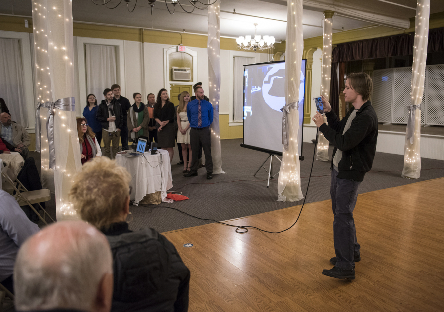 Connor Goglin, a consultant with Washington State University Vancouver’s augmented reality program, explains how the Providence Academy Journey app shows the building’s history in the space where it happened.