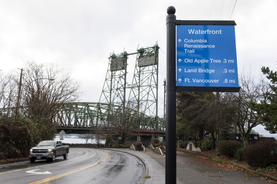 A wayfinding sign next to the intersection of Columbia Way and Columbia Street is visible near downtown Vancouver.