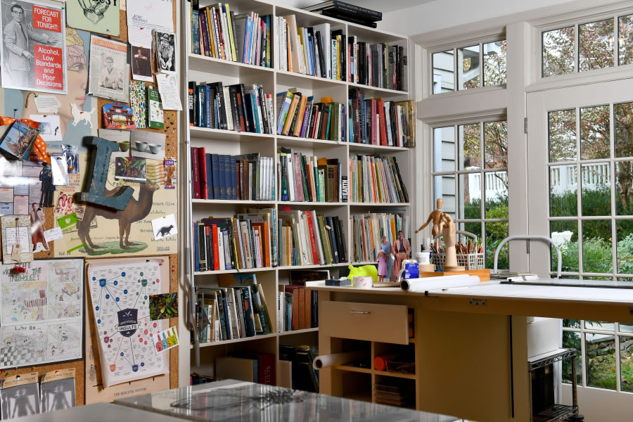 Built-in bookcases help define some of the space in artist Larry Kirkland’s home office/studio.