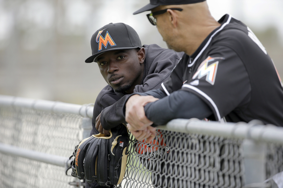 The Miami Marlins traded second baseman Dee Gordon, left, to the Seattle Mariners on Thursday for three prospects and international slot money.