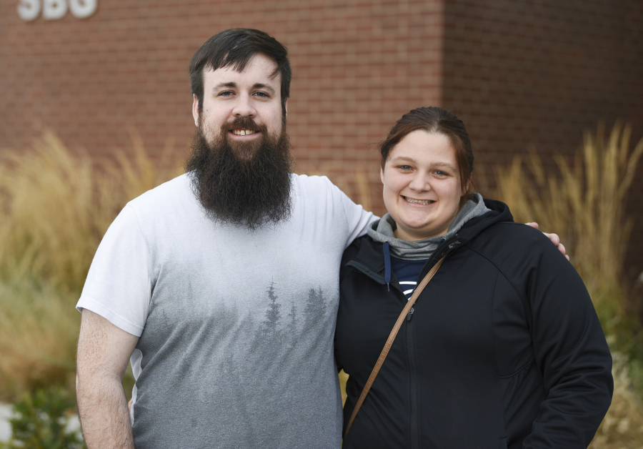 Cody Messick, left, and his wife, Kasey Cannon, outside the STEM building at Clark College in November.