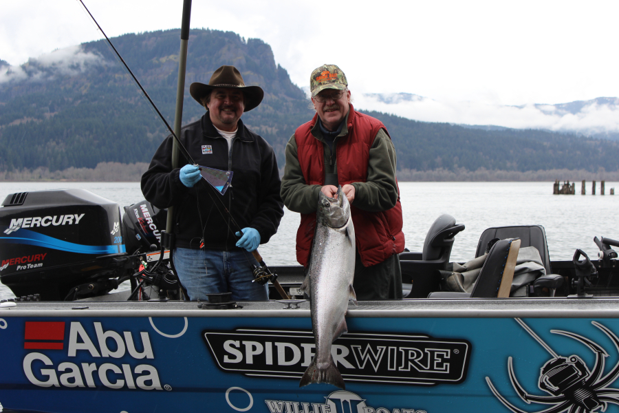 Terry Otto, (right), and host Buzz Ramsey with a Columbia River spring chinook. 166,700 “springer” adults are expected to pass over Bonneville Dam.