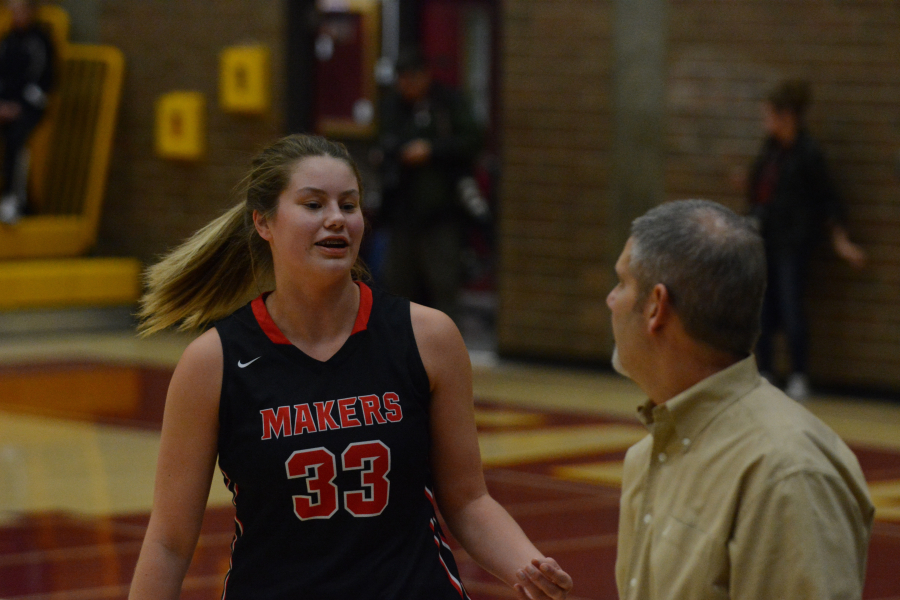 Courtney Clemmer and coach Scott Preuninger talk during a Camas game against Prairie earlier this season. A senior all-league post, Clemmer will be counted on more after the Papermakers lost fellow post Madison Freemon to injury.