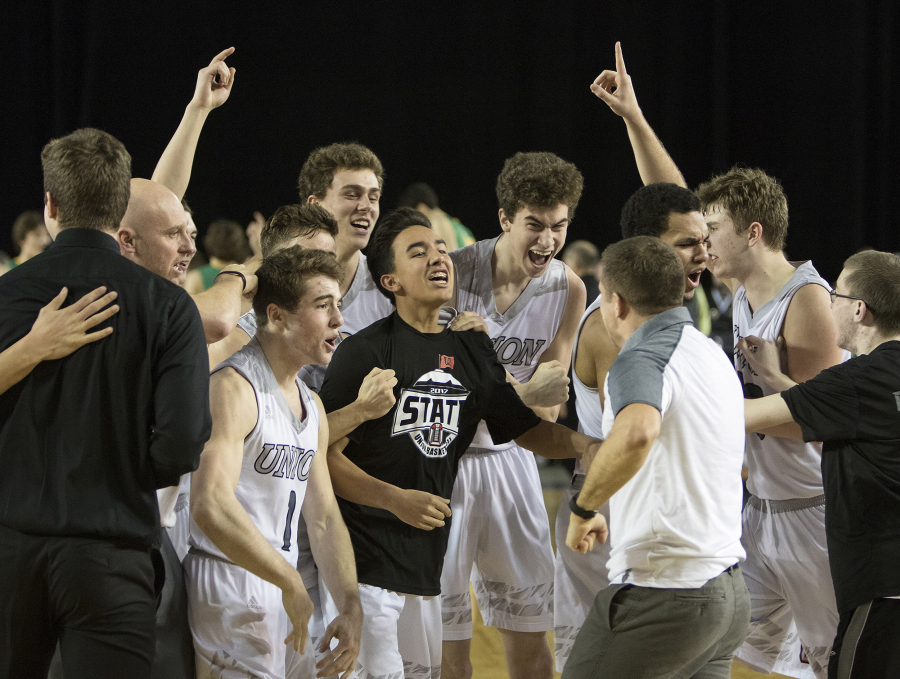 Union’s players and coaches react after defeating Richland in the state semifinals in March. That playoff pedigree, and the experience of winning high-stakes games, has Union a favorite to win its seventh straight league title.