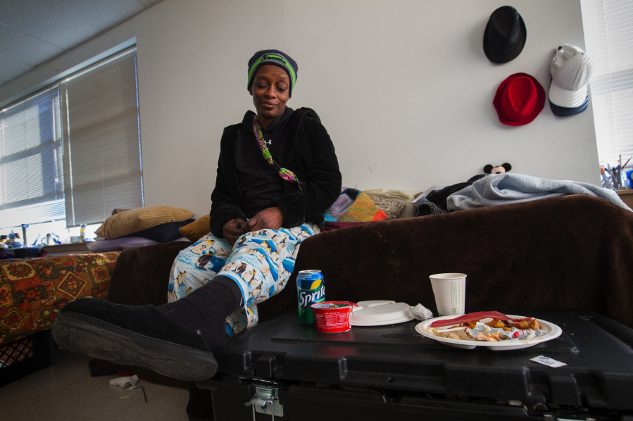 Jacqueline Martin sits on her bed and talks about life at the Navigation Center in Seattle, Wash. where she has been living since July. She plans to go to law school and to become a lawyer. (Ellen M.