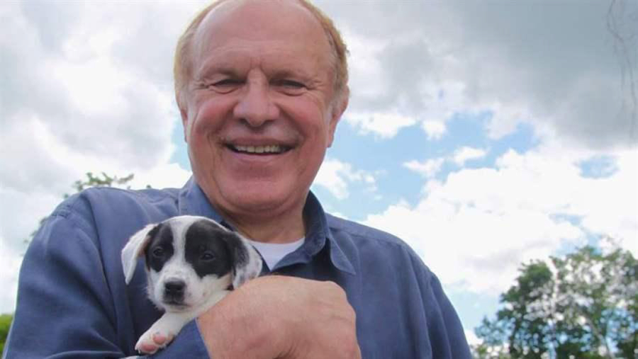 Democratic state Sen. Raymond Lesniak holds a rescue puppy at a “Paws Walk for a Cause” fundraiser in New Jersey.
