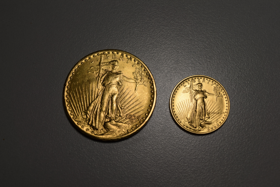 Salvation Army of Vancouver found a 1-ounce gold coin, left, in one of its red kettles on Friday. A ¼-ounce gold coin was found a couple of weeks ago. The two coins are collectively worth more than $1,500.