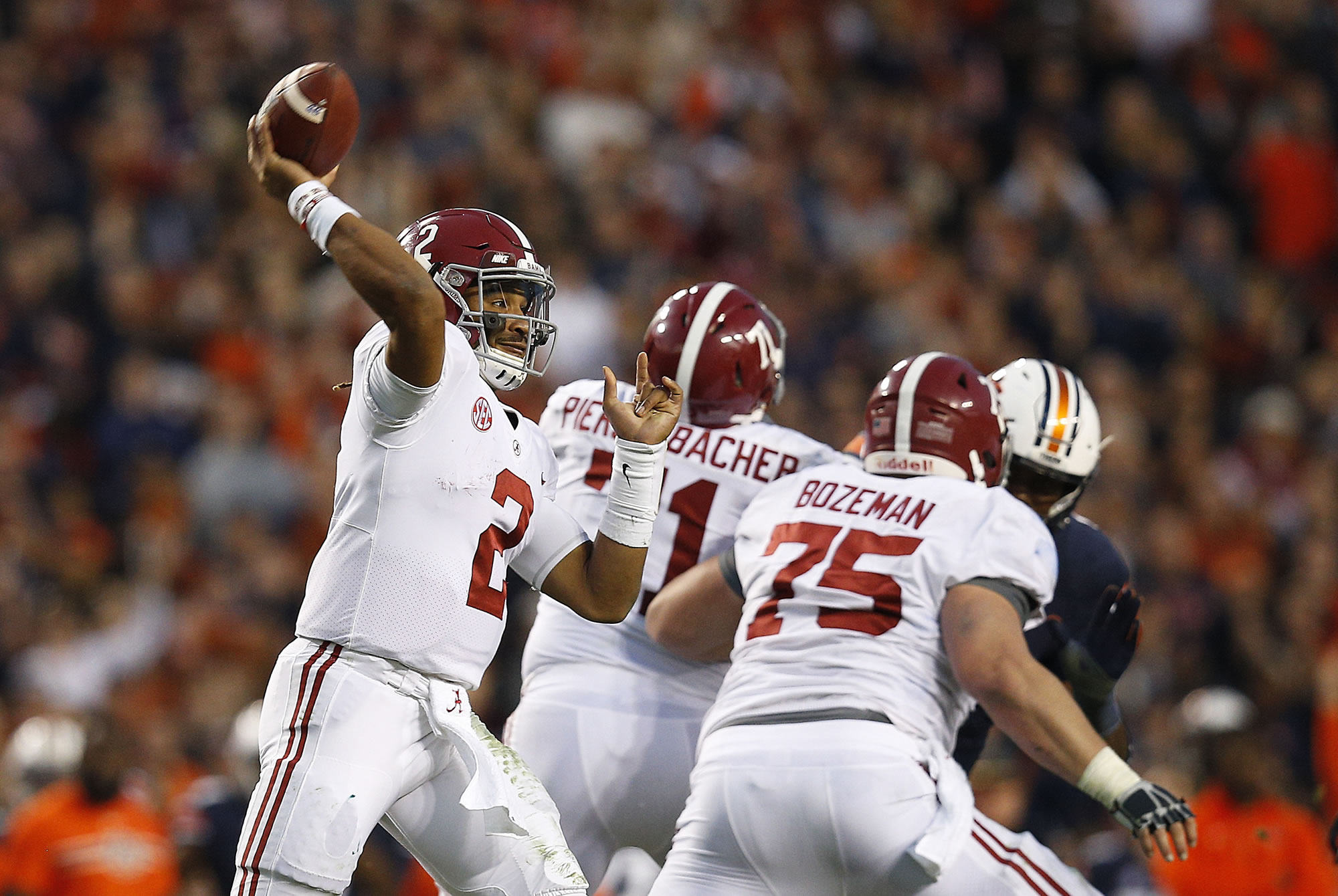 Alabama quarterback Jalen Hurts throws the ball during the second half of the Iron Bowl in Auburn, Ala. The Associated Press voters prefer Alabama over Ohio State. In the final Top 25 of the 2017 regular season, the Crimson Tide was No. 4 and the Buckeyes were No. 5.