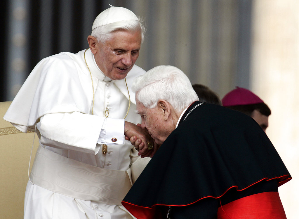 FILE - In this Wednesday June 7, 2006 file photo, Cardinal Bernard Law, right, kisses Pope Benedict XVI's hand at the end of the weekly general audience in St. Peter's Square at the Vatican. An official with the Catholic Church said Tuesday, Dec. 19, 2017, that Cardinal Bernard Law, the disgraced former archbishop of Boston, has died at 86. Law recently had been hospitalized in Rome and died early Wednesday.