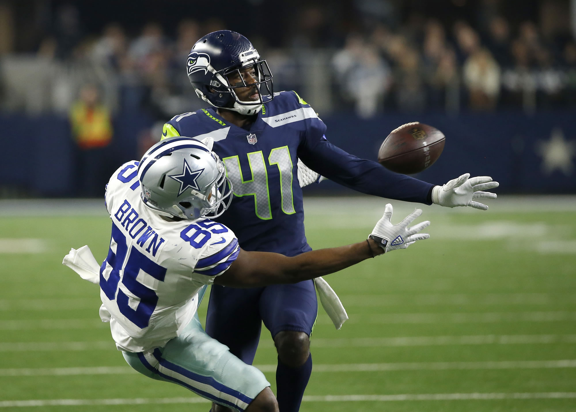 Seattle Seahawks cornerback Byron Maxwell (41) breaks up a pass intended for Dallas Cowboys' Noah Brown (85) in the second half of an NFL football game, Sunday, Dec. 24, 2017, in Arlington, Texas. Maxwell was charged with pass interference on the play.