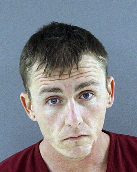 This undated photo released by the Knox County (Tenn.) Sheriff's office, shows suspect Michael Scott Wilson. Wilson is accused of rigging the front door of his estranged wife's apartment in an attempt to cause great bodily harm, according to Flagler County, (Fla.) authorities. Wilson is charged with attempted aggravated battery on a pregnant woman and grand theft of a firearm.