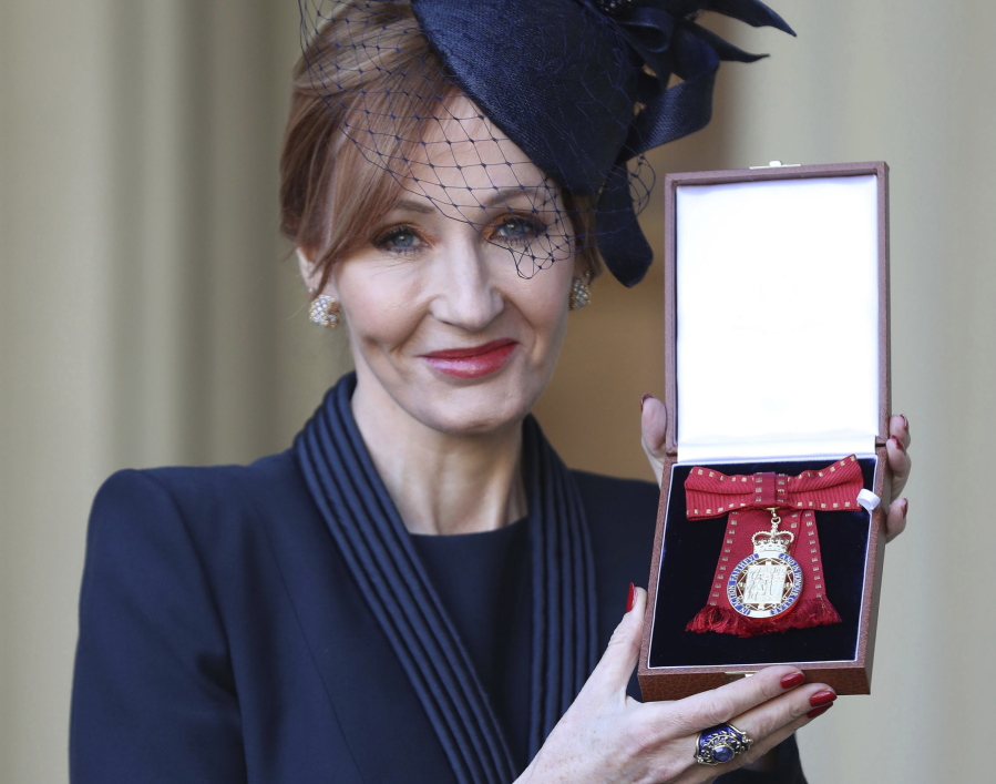 The author of the Harry Potter books, J.K. Rowling poses Dec. 12 after she was made a Companion of Honour during an investiture ceremony at Buckingham Palace in London.