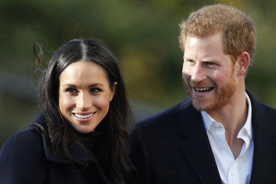Britain’s Prince Harry and his fiancee, Meghan Markle, arrive Dec. 1 at Nottingham Academy in Nottingham, England.