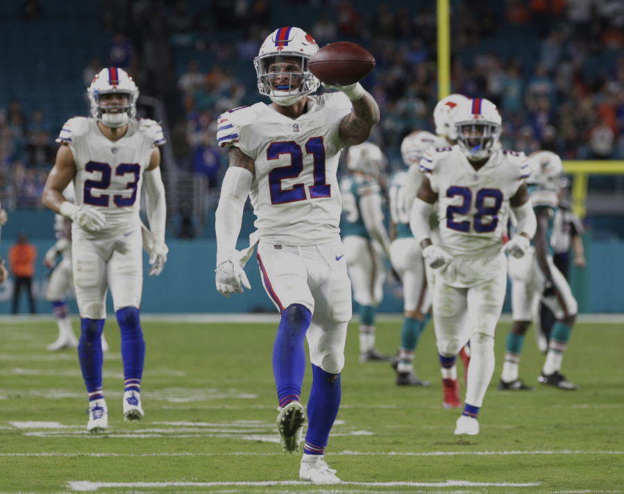 Buffalo Bills free safety Jordan Poyer (21) shows the ball after he intercepted a pass late in the second half of an NFL football game against the Miami Dolphins, Sunday, Dec. 31, 2017, in Miami Gardens, Fla. The Bills defeated the Dolphins 22-16.