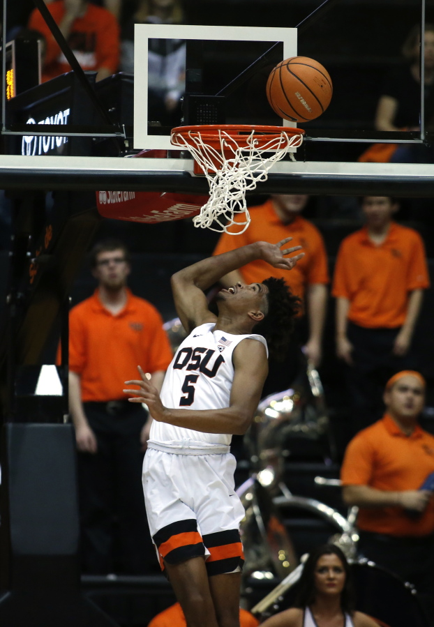 Oregon State’s Ethan Thompson (5) watches his shot go into the basket during the first half of an NCAA college basketball game against Colorado in Corvallis, Ore., Friday, Dec. 29, 2017. (AP Photo/Timothy J.