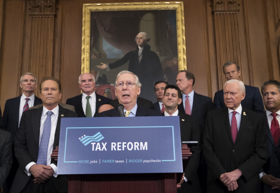 Senate Majority Leader Mitch McConnell, R-Ky., center, joining Speaker of the House Paul Ryan, R-Wis., and other GOP lawmakers to talk Sept. 27 about the Republicans’ proposed rewrite of the tax code for individuals and corporations, at the Capitol in Washington. (AP Photo/J.