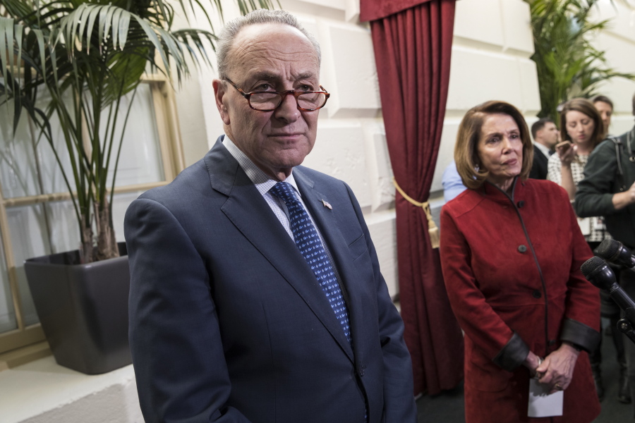 Senate Minority Leader Chuck Schumer, D-N.Y., and House Minority Leader Nancy Pelosi, D-Calif., right, speak to reporters just before House and Senate tax bill conferees meet to work on the sweeping overhaul of the nation’s tax laws, on Capitol Hill in Washington, Wednesday, Dec. 13, 2017. Democrats are objecting to the bill and are asking that a final vote be delayed until Senator-elect Doug Jones of Alabama is seated. (AP Photo/J.