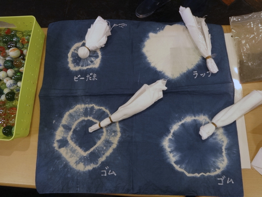 Samples demonstrate how to wrap fabric for different patterns at the Wanariya indigo dye workshop in Tokyo.