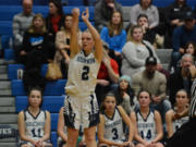 Hockinson senior Payton Wangler releases on a 3-point attempt in the fourth quarter of a 56-48 win over Woodland at Hockinson High School, on Monday, Dec.