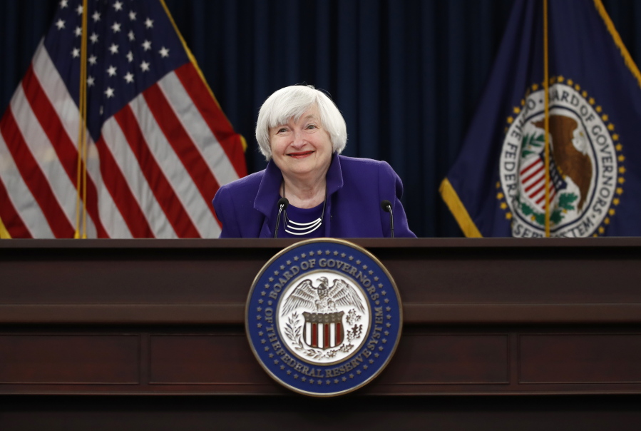 Federal Reserve Chair Janet Yellen smiles at the conclusion of a news conference following the Federal Open Market Committee meeting Wednesday in Washington. As expected, the Federal Reserve has boosted a key short-term interest rate at the last U.S. central bank meeting that Yellen is expected to lead.