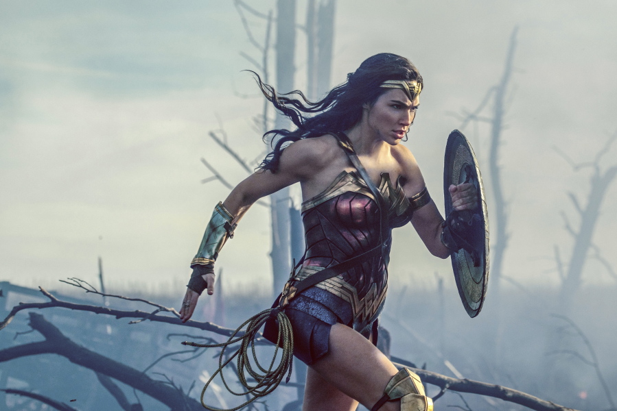 Gal Gadot charges through No Man’s Land during a WWI battle scene from “Wonder Woman.” Warner Bros.