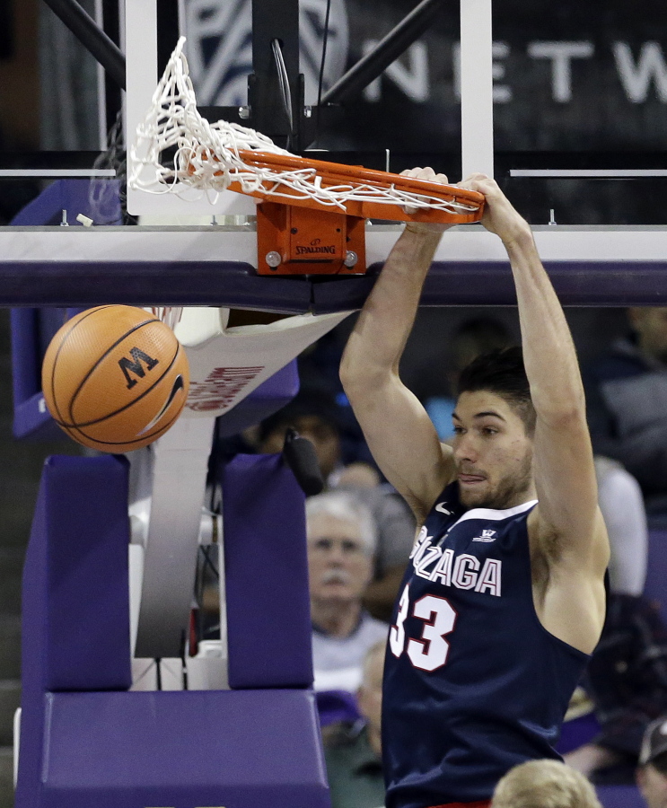 Gonzaga’s Killian Tillie dunks against Washington in the first half of an NCAA college basketball game Sunday, Dec. 10, 2017, in Seattle.