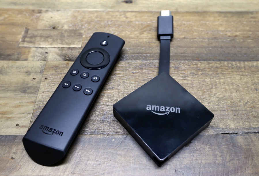 FILE - This Wednesday, Sept. 27, 2017, file photo shows an Amazon Fire TV streaming device with its remote control. On Tuesday, Dec. 5, 2017, Google announced plans to pull its popular YouTube video service from Amazon’s Fire TV and Echo Show devices in an escalating feud that has caught consumers in the crossfire.