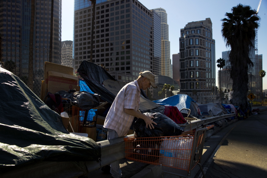 A man who identified himself just as Vincent, sorts his belongings outside his tent Dec. 1 in Los Angeles. Vincent said he thought he was bulletproof and never had to worry about getting a job as a young man. “Things ain’t the way they were anymore.” The U.S. Department on Housing and Urban Development release of the 2017 homeless numbers are expected to show a dramatic increase in the number of people lacking shelter along the West Coast. (AP Photo/Jae C.