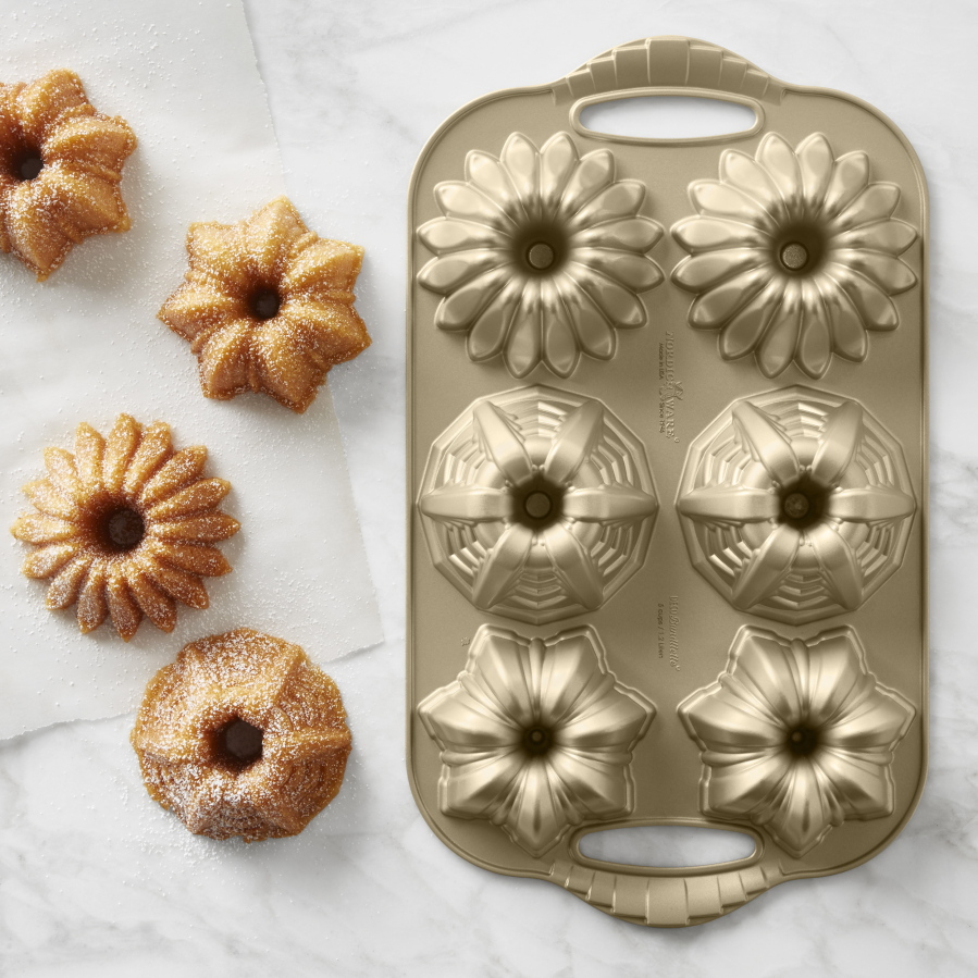 Williams-Sonoma’s Nordic Ware cakelet pans inspired by Art Deco patterns. A tough commercial-grade finish makes them long-lasting performers in the baking kitchen.