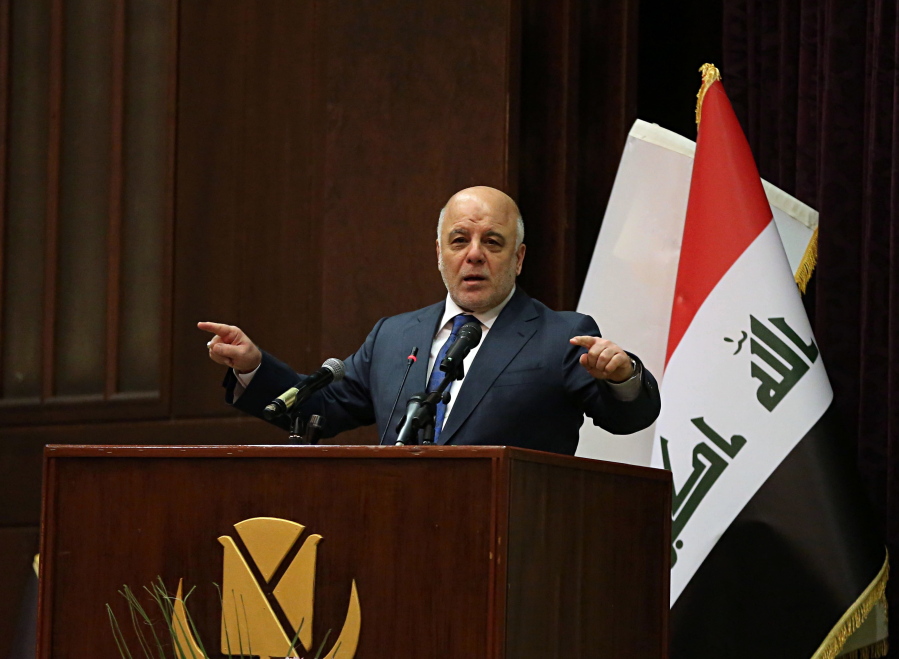 Iraq Prime Minister Haider al-Abadi gestures, during a press conference, in Baghdad, Iraq, Saturday, Dec. 9, 2017. Iraq said Saturday that its war on the Islamic State is over after more than three years of combat operations drove the extremists from all of the territory they once held. -Abadi announced Iraqi forces were in full control of the country’s border with Syria during remarks at a conference in Baghdad, and his spokesman said the development marked the end of the military fight against IS.