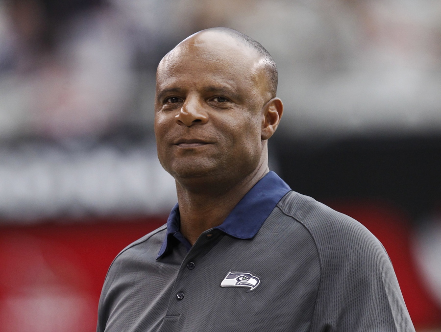 Warren Moon walks along the sideline prior to a 2012 NFL football game between the Seattle Seahawks and the Arizona Cardinals in Glendale, Ariz. Hall of Fame quarterback Moon has been accused of sexual harassment by an assistant for his sports marketing firm, according to a lawsuit filed in California. The civil lawsuit was filed Monday in Orange County Superior Court. According to court documents, Wendy Haskell alleges Moon made “unwanted and unsolicited” sexual advances as part of her role as his assistant working for Sports 1 Marketing. Moon is the co-founder and president of the company. (AP Photo/Ross D.