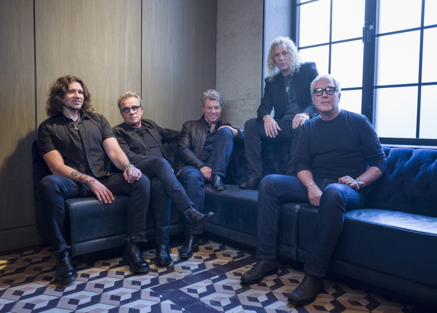 FILE - In this Oct. 19, 2016 file photo, members of Bon Jovi from left, Phil X, Tico Torres, Jon Bon Jovi, David Bryan and Hugh McDonald pose for a portrait in New York. The band will be inducted into the Rock and Roll Hall of Fame on April 14, 2018 in Cleveland, Ohio.
