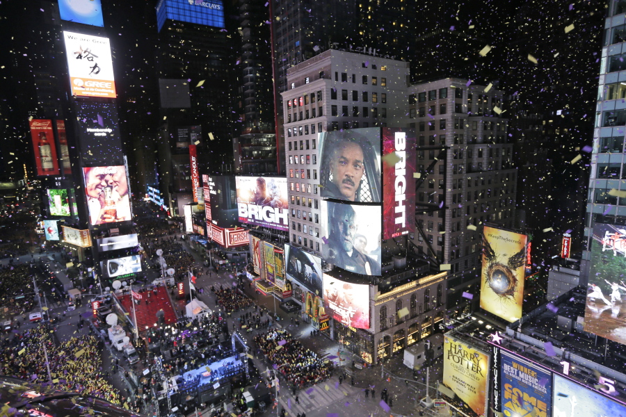 Confetti flies over Times Square on Sunday during the New Year’s celebration in New York.