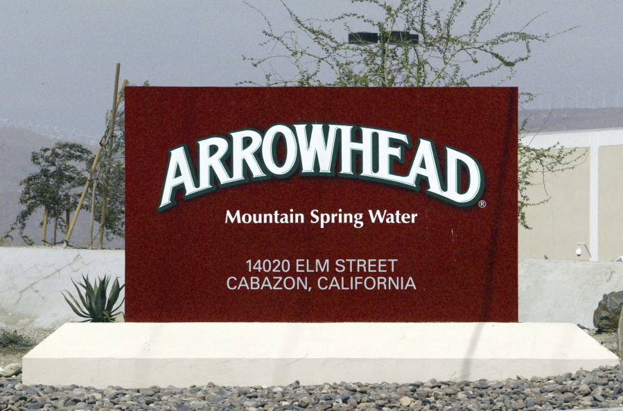 FILE - In this July, 7, 2004, file photo, a sign at the entrance to the Arrowhead Mountain Spring Water Company bottling plant, owned by Swiss conglomerate Nestle, on the Morongo Indian Reservation near Cabazon, Calif. Nestle, which sells Arrowhead bottled water, may have to stop taking millions of gallons of water from Southern California’s San Bernardino National Forest because state regulators concluded it lacks valid permits. The State Water Resources Control Board notified the company on Wednesday, Dec. 20, 2017, that an investigation concluded it doesn’t have proper rights to pipe about three-quarters of the water it currently withdraws for bottling.