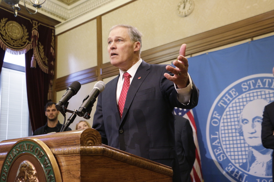 Gov. Jay Inslee talks to the media in Olympia on Wednesday. Inslee said Wednesday he fears President Donald Trump might launch a pre-emptive war with North Korea.