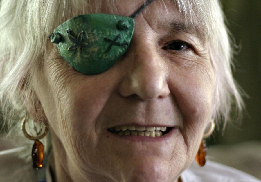 FILE - In this June 27, 2007 file photo, JoAnna McKee poses in Seattle. McKee, a pioneering medical marijuana activist in Washington state, died Nov. 18, 2017. She was 74. McKee was instrumental in working to pass Washington’s medical marijuana initiative and pushing lawmakers to support patients.