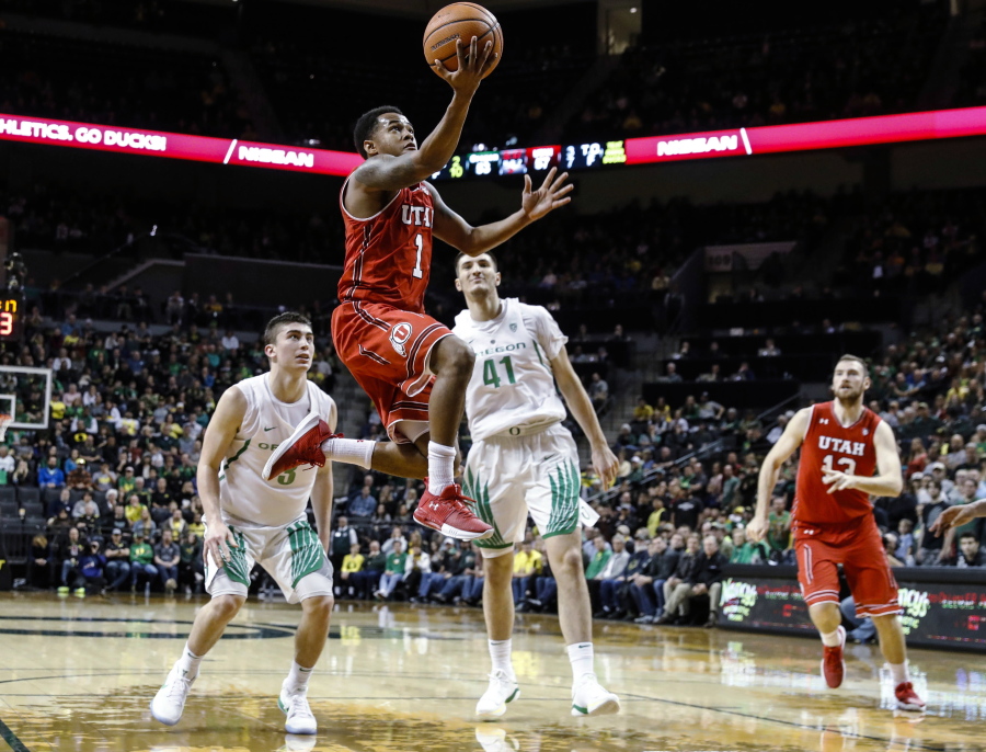 Utah guard Justin Bibbins (1) drives to the basket against Oregon during an NCAA college basketball game Friday, Dec. 29, 2017, in Eugene, Ore.