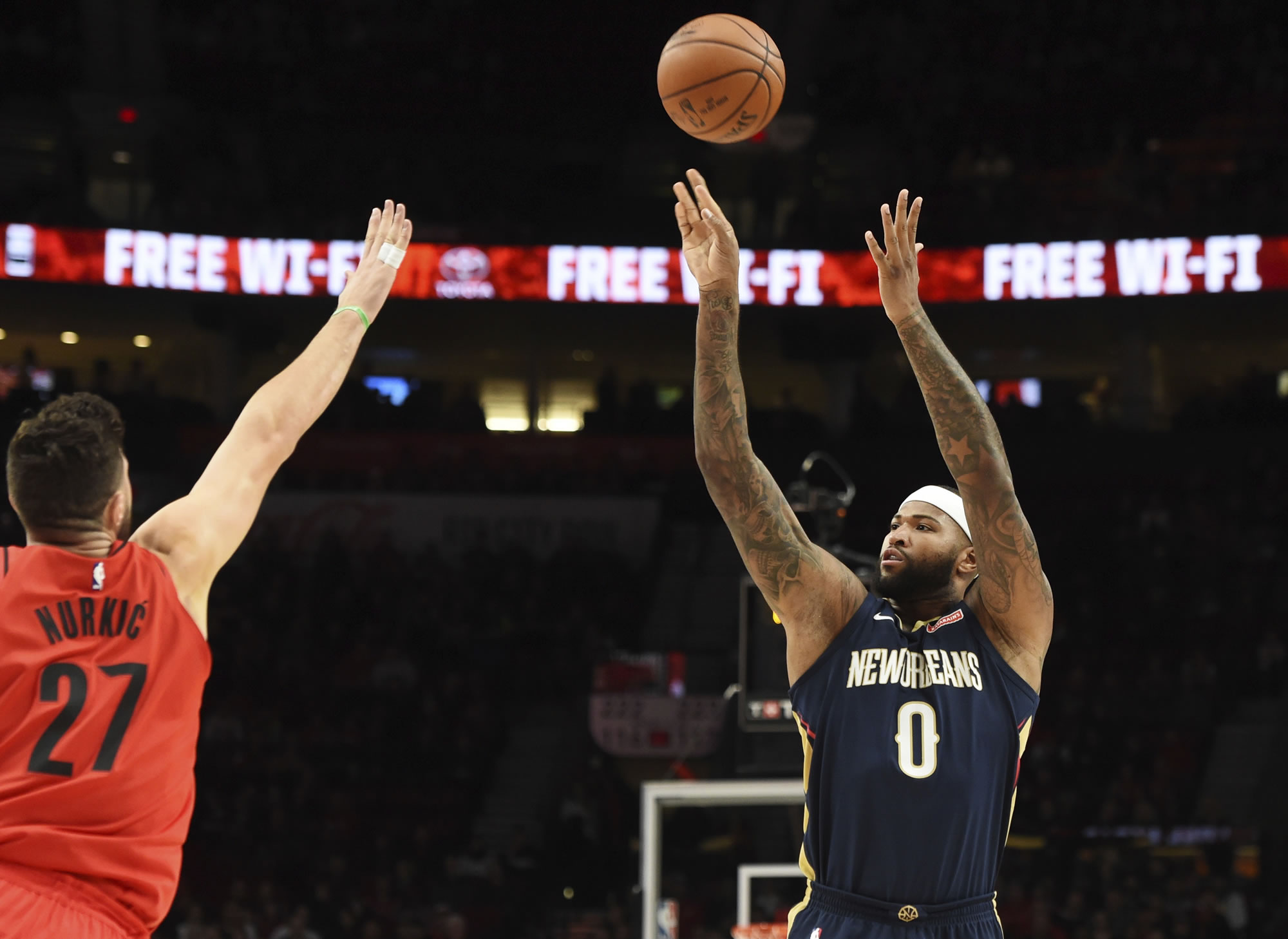 New Orleans Pelicans center DeMarcus Cousins shoots over Portland Trail Blazers center Jusuf Nurkic during the first half of an NBA basketball game in Portland, Ore., Saturday, Dec. 2, 2017.