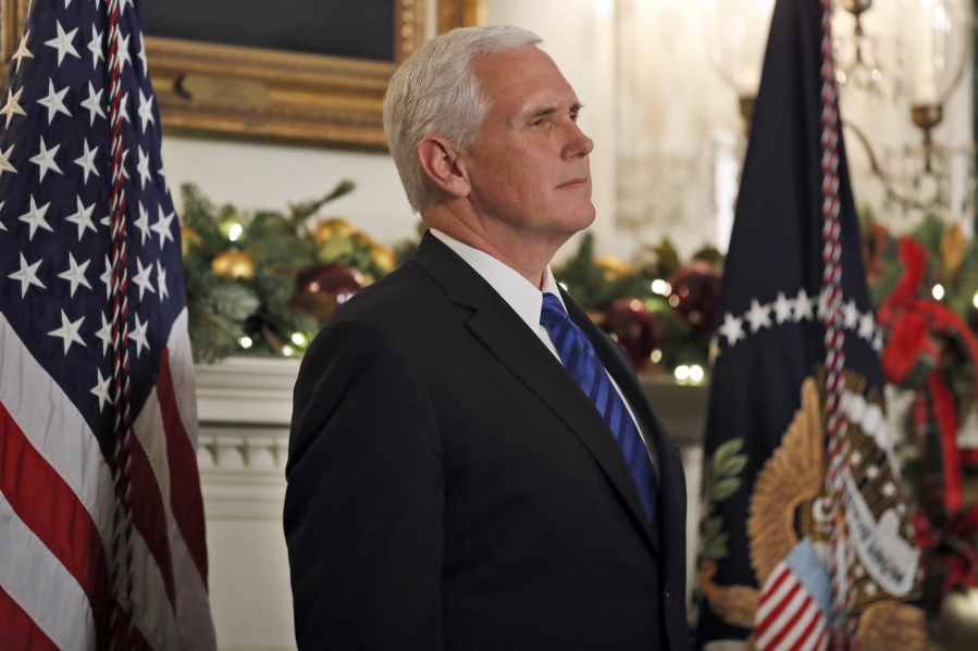 In this Dec. 6, 2017, photo, Vice President Mike Pence listens as President Donald Trump speaks in the Diplomatic Reception Room of the White House, Wednesday, Dec. 6, 2017, in Washington. Senior Trump administration officials outlined their view on Dec. 15, that Jerusalem’s Western Wall ultimately will be declared a part of Israel, in another declaration sure to enflame passions among Palestinians and others in the Middle East. Although they said the ultimate borders of the holy city must be resolved through Israeli-Palestinian negotiations, the officials, speaking ahead of Pence’s trip to the region, essentially ruled out any scenario that didn’t maintain Israeli control over the holiest ground in Judaism.