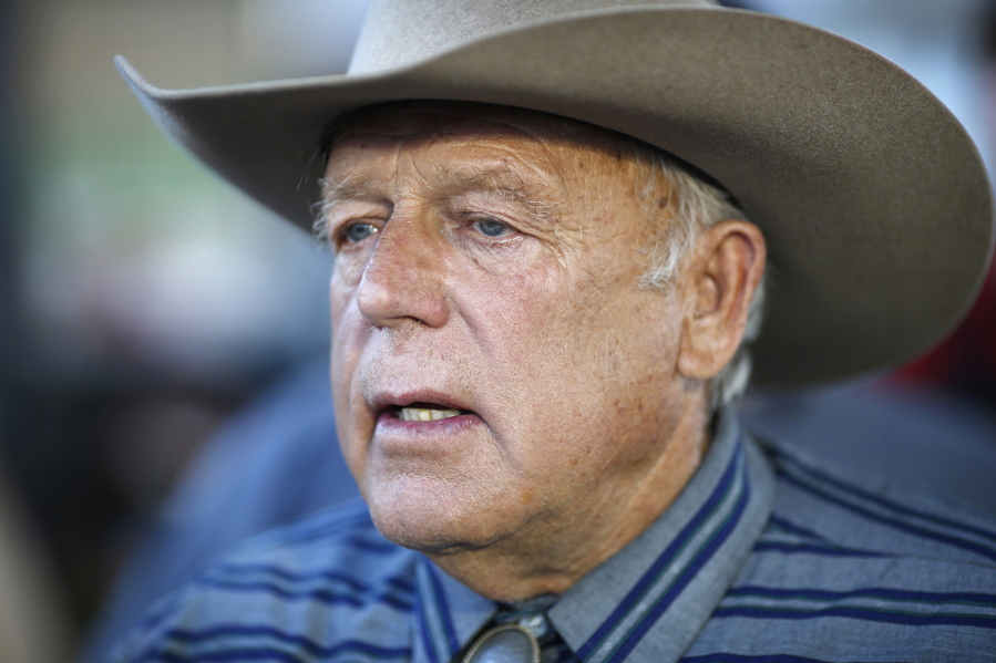 Nevada rancher Cliven Bundy speaks April 11, 2015, with supporters at an event in Bunkerville, Nev. A lead investigator looking into how the U.S. Bureau of Land Management handled an armed standoff with the Bundy family and supporters in Nevada is alleging misconduct in an 18-page memo that has surfaced during a trial on federal charges.